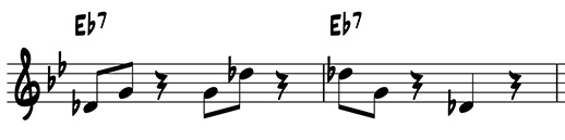 Two-measure riff using scale degrees 3 and 7 on E flat 7